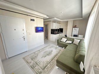 TRAMVAY DURAĞA VE SAHİLE YAKIN EŞYALI 1+1 SATILIK