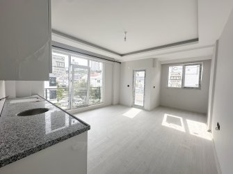 %80 İNE KREDİLİ ARA KAT SIFIR BALKONLU 1+1 DAİRE